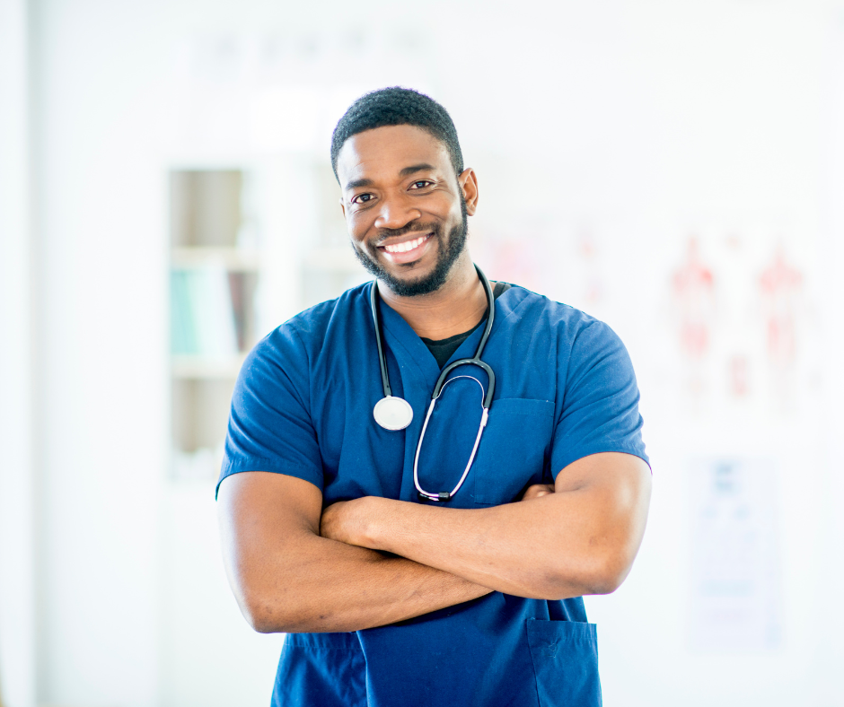 Male nurse smiling with arms crossed